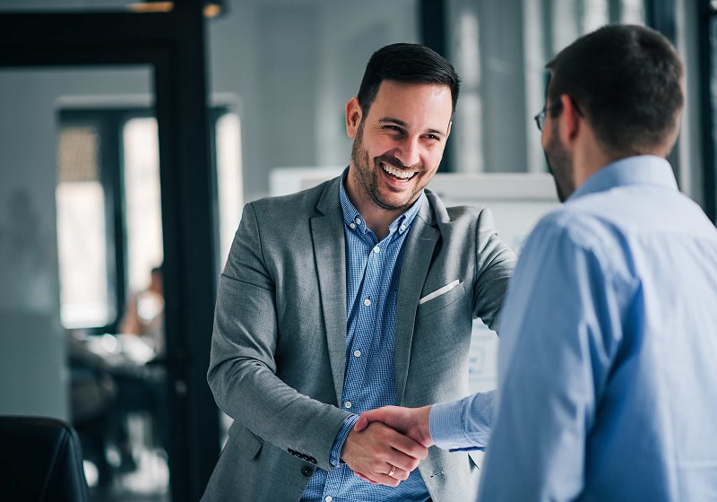 KT - 2 Businessmen shaking hand
