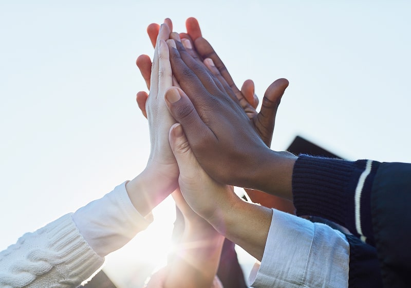 KT - Group of people high five