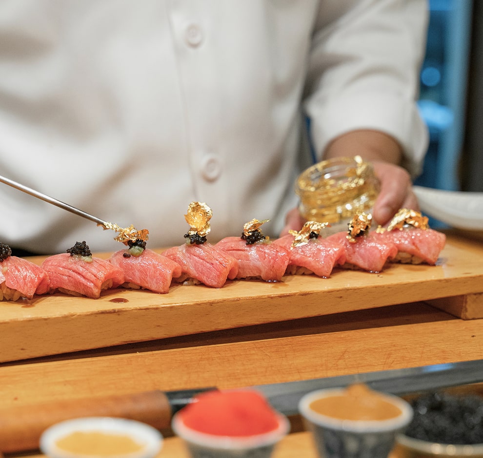 KT - Photo of a chef making sushi