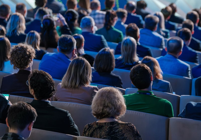 KT - German audience listening to conference