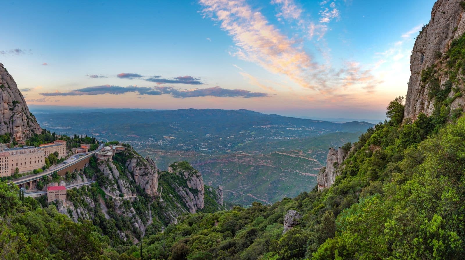 The monastery of Santa Maria de Montserrat below Catalonia’s mountain peaks at sunset.