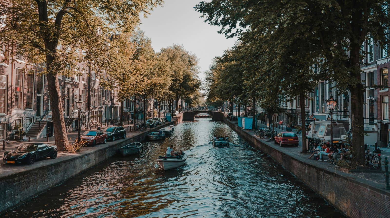 Historic canal houses lining a waterway in central Amsterdam.