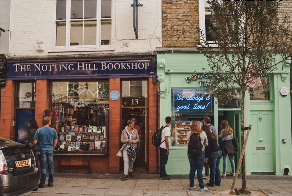 Small bookstore in London England with people leaving