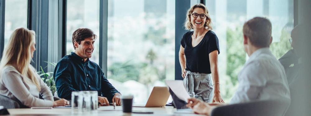 KT - People laughing in staff meeting