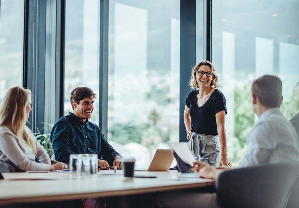 KT - People laughing in staff meeting