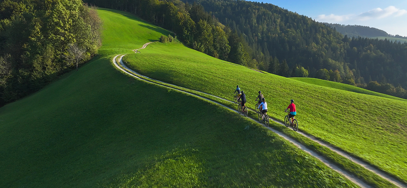 KT - People biking on a hill