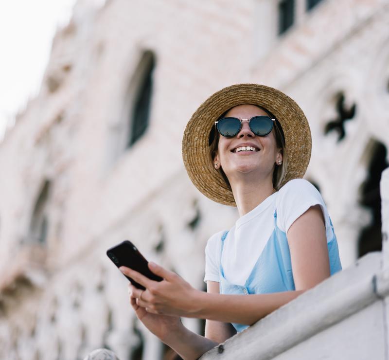 KT - Digital Tools - Photo of Woman Smiling and Holding a mobile phone