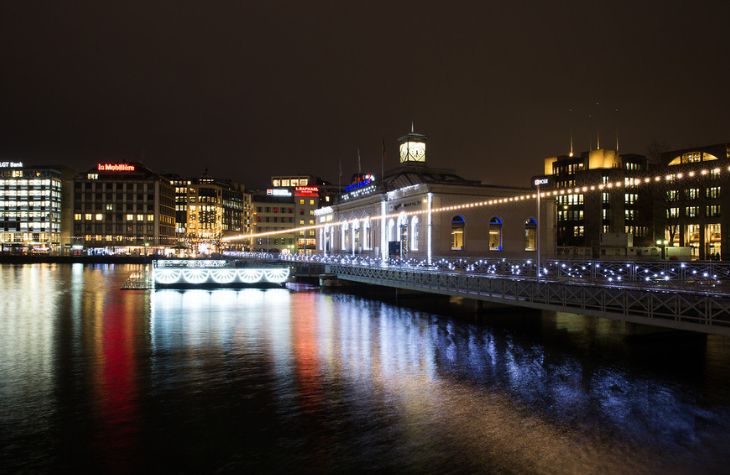 
A bridge over a body of water with lights