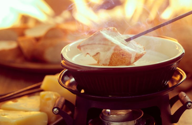 A person stirring food in a pot